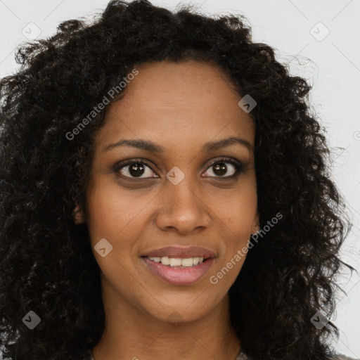 Joyful black young-adult female with long  brown hair and brown eyes