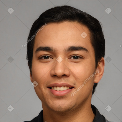 Joyful white young-adult male with short  black hair and brown eyes