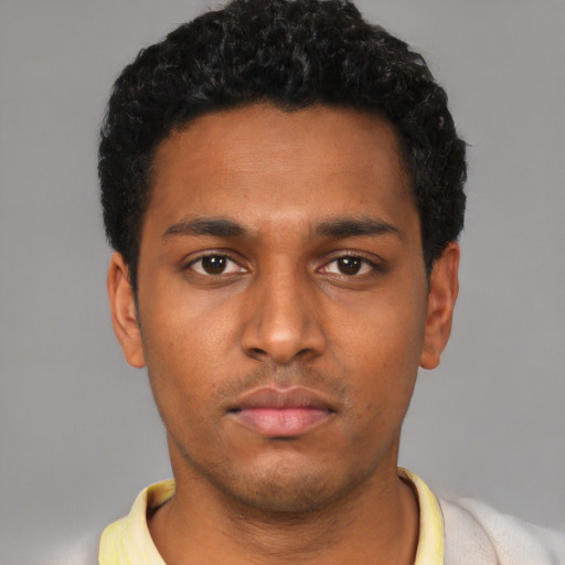 Neutral black young-adult male with short  black hair and brown eyes