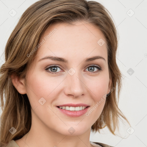 Joyful white young-adult female with medium  brown hair and blue eyes