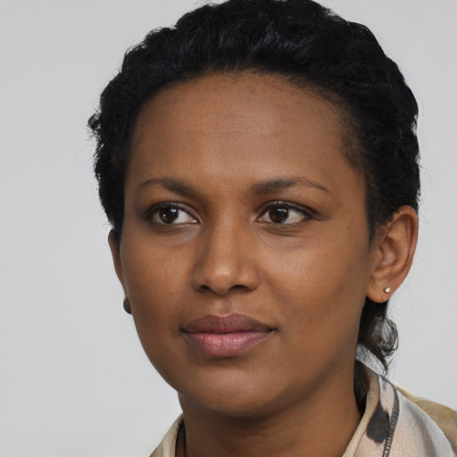 Neutral black young-adult female with short  black hair and brown eyes
