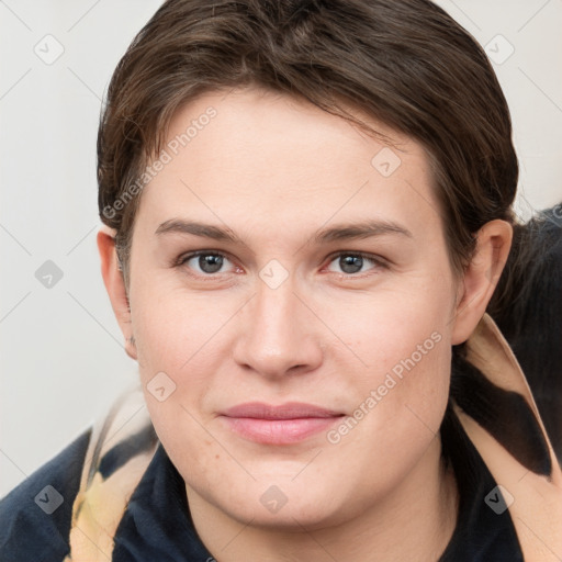 Joyful white young-adult female with medium  brown hair and grey eyes