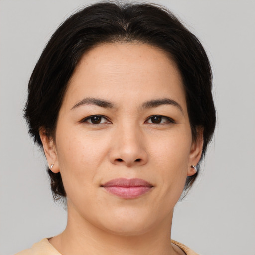 Joyful asian young-adult female with medium  brown hair and brown eyes