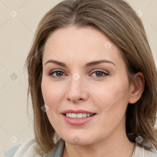 Joyful white young-adult female with medium  brown hair and green eyes