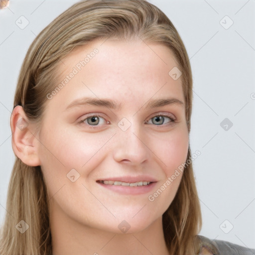 Joyful white young-adult female with long  brown hair and blue eyes