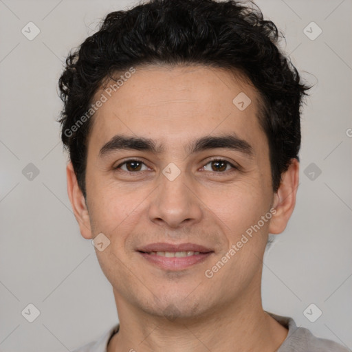 Joyful white young-adult male with short  black hair and brown eyes