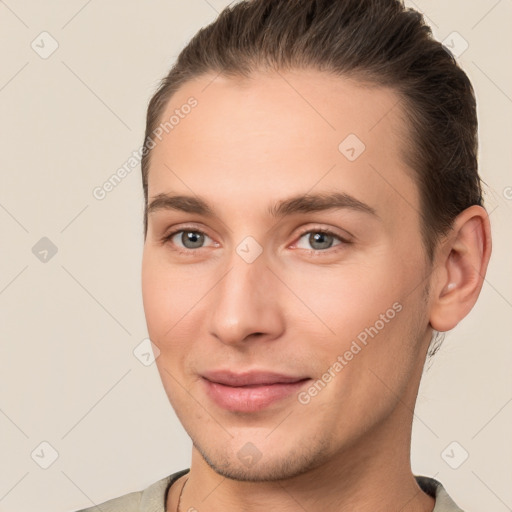 Joyful white young-adult male with short  brown hair and brown eyes