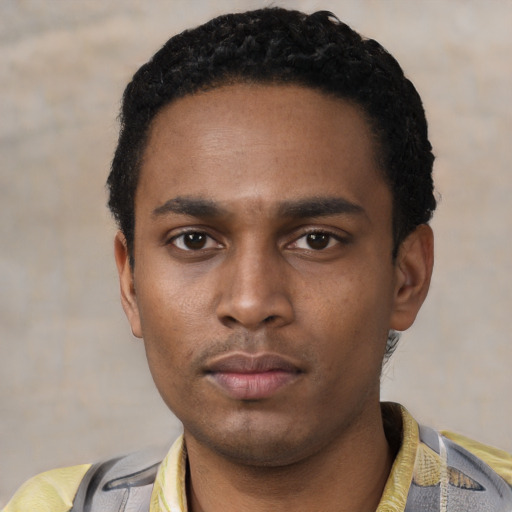 Neutral latino young-adult male with short  black hair and brown eyes