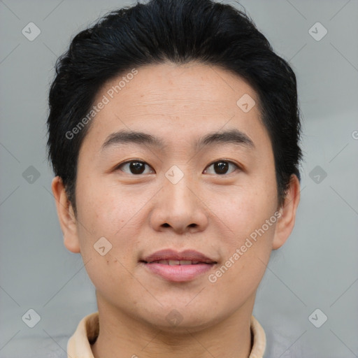 Joyful asian young-adult male with short  brown hair and brown eyes