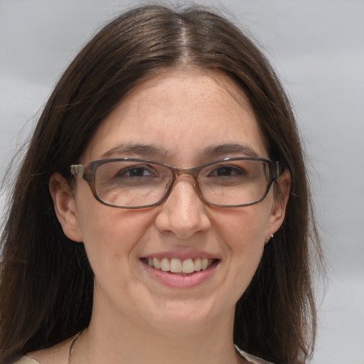 Joyful white adult female with medium  brown hair and brown eyes