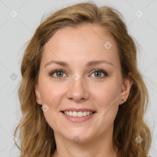 Joyful white young-adult female with long  brown hair and green eyes