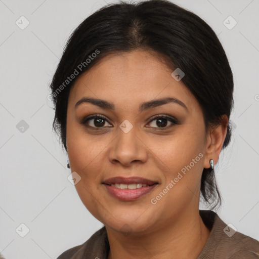 Joyful latino young-adult female with medium  brown hair and brown eyes