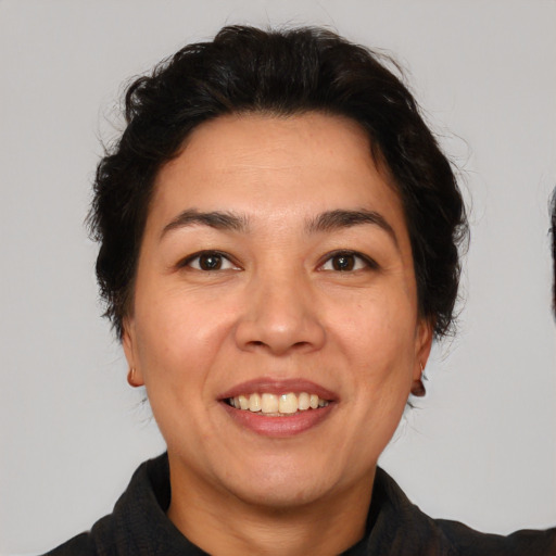 Joyful white adult female with short  brown hair and brown eyes