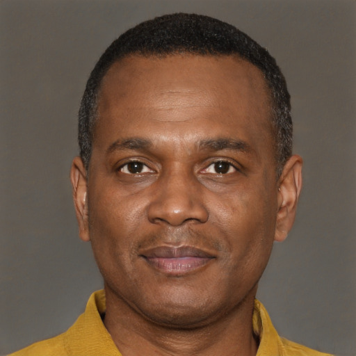 Joyful latino adult male with short  brown hair and brown eyes