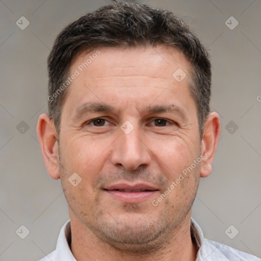 Joyful white adult male with short  brown hair and brown eyes