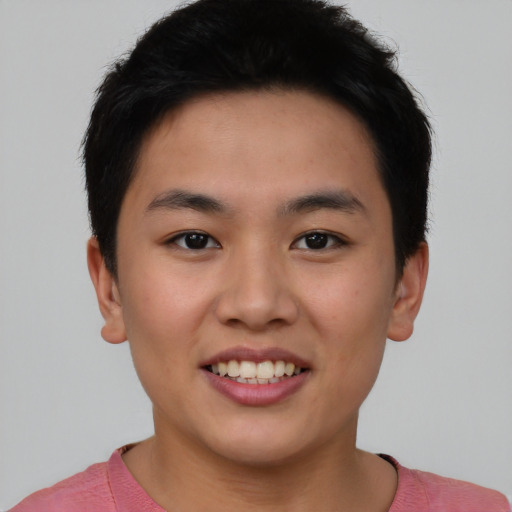 Joyful asian young-adult male with short  brown hair and brown eyes