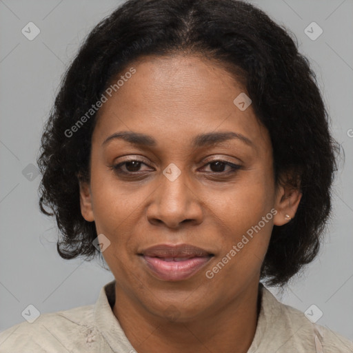 Joyful latino adult female with medium  brown hair and brown eyes