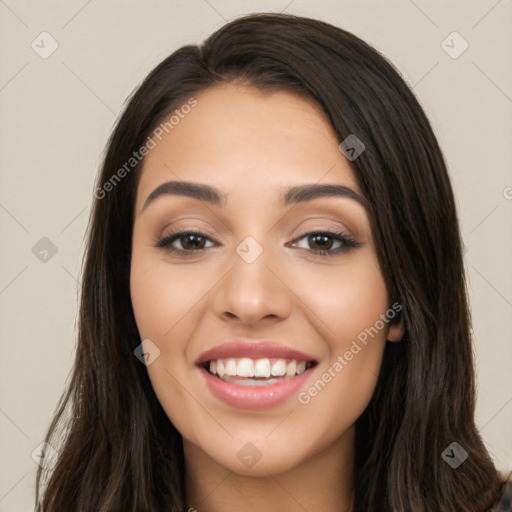 Joyful white young-adult female with long  black hair and brown eyes