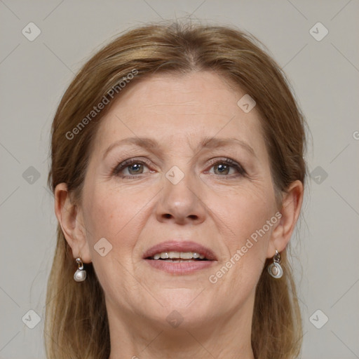 Joyful white adult female with medium  brown hair and grey eyes