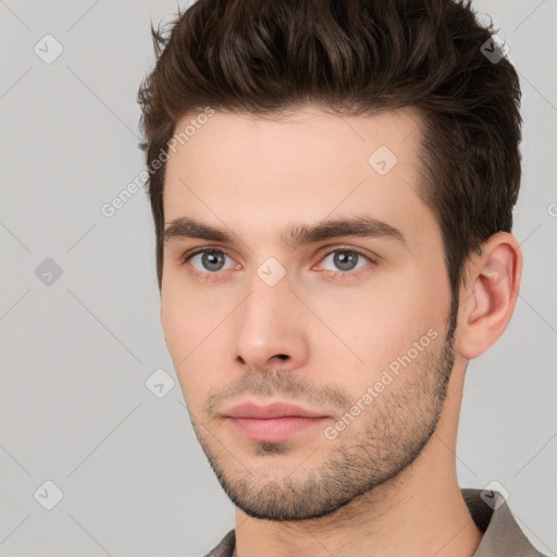 Neutral white young-adult male with short  brown hair and brown eyes