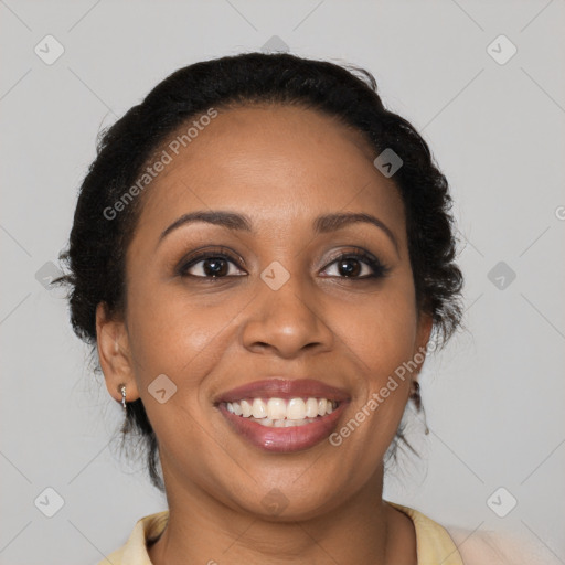 Joyful black young-adult female with long  brown hair and brown eyes