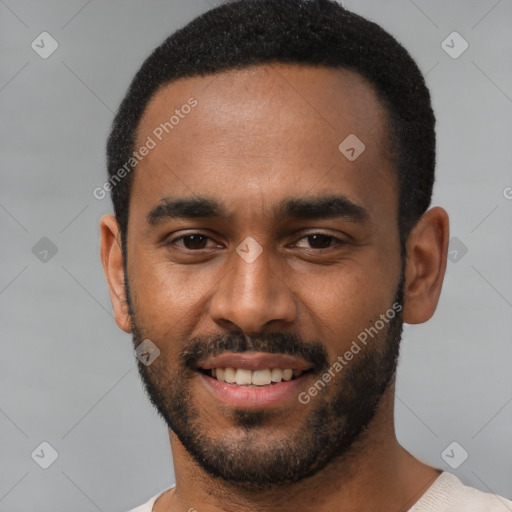 Joyful black young-adult male with short  black hair and brown eyes