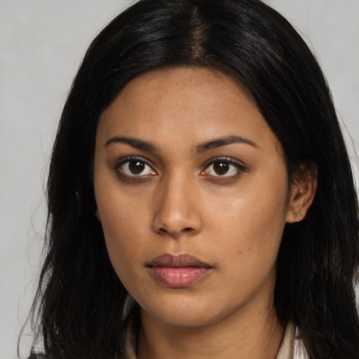 Neutral latino young-adult female with long  black hair and brown eyes