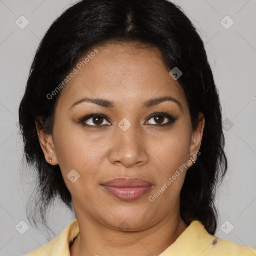 Joyful latino adult female with medium  brown hair and brown eyes