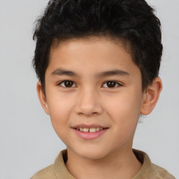 Joyful white child male with short  brown hair and brown eyes