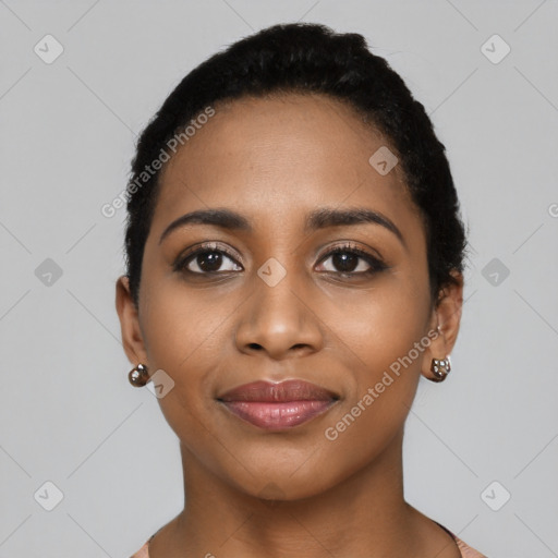 Joyful black young-adult female with short  black hair and brown eyes