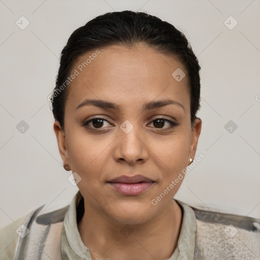 Joyful latino young-adult female with short  brown hair and brown eyes