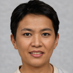 Joyful asian young-adult male with short  black hair and brown eyes