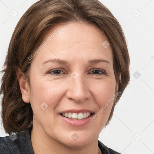 Joyful white adult female with medium  brown hair and grey eyes