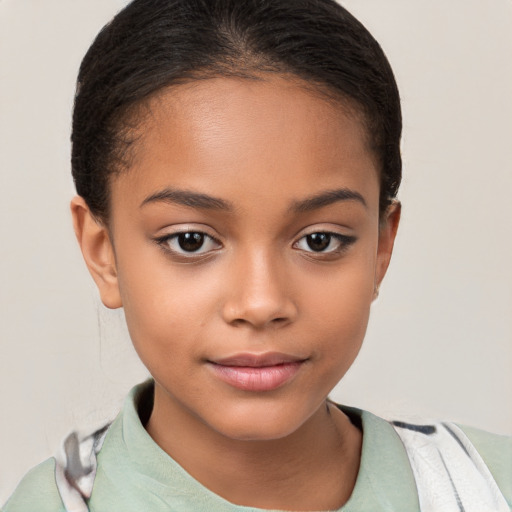 Joyful latino child female with short  brown hair and brown eyes