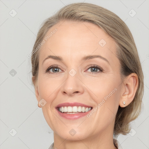 Joyful white young-adult female with medium  brown hair and blue eyes