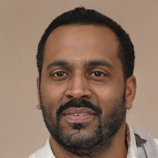 Neutral latino adult male with short  black hair and brown eyes