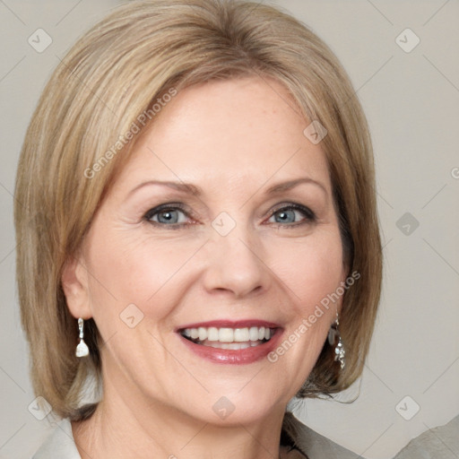 Joyful white adult female with medium  brown hair and blue eyes