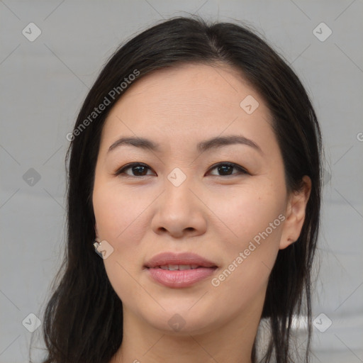 Joyful asian young-adult female with long  brown hair and brown eyes