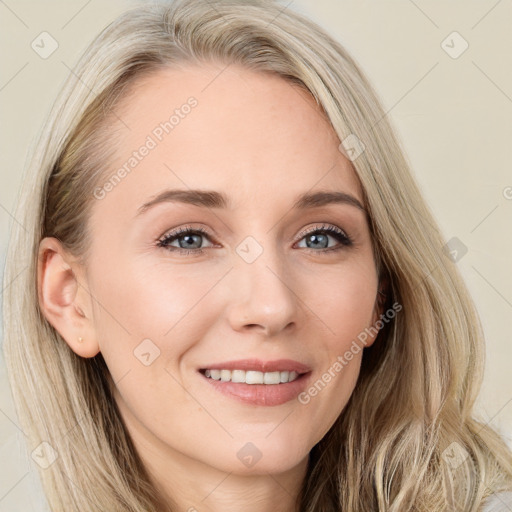 Joyful white young-adult female with long  brown hair and blue eyes