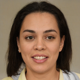 Joyful latino young-adult female with medium  brown hair and brown eyes