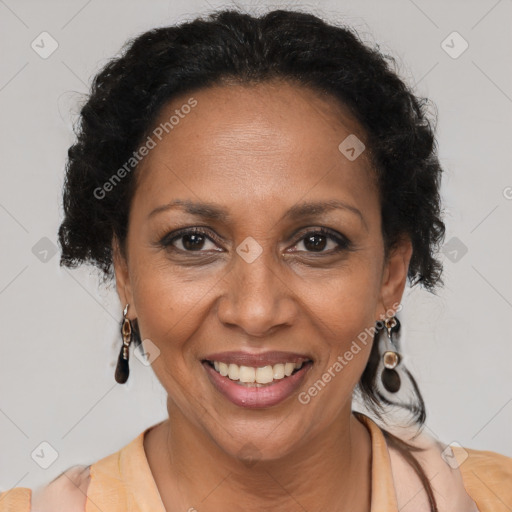 Joyful black adult female with medium  brown hair and brown eyes