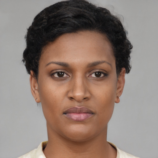 Neutral black young-adult female with short  brown hair and brown eyes