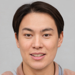 Joyful asian young-adult male with short  brown hair and brown eyes