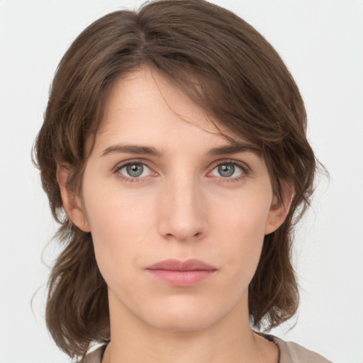 Neutral white young-adult female with medium  brown hair and grey eyes