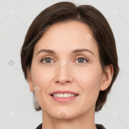 Joyful white adult female with short  brown hair and brown eyes