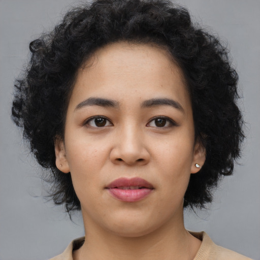 Neutral black young-adult female with medium  black hair and brown eyes