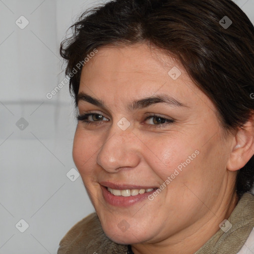 Joyful white adult female with short  brown hair and brown eyes