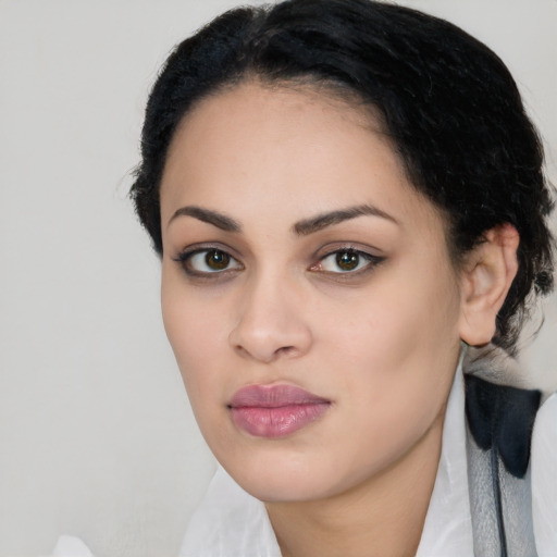 Joyful latino young-adult female with medium  black hair and brown eyes