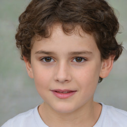 Joyful white child male with short  brown hair and brown eyes