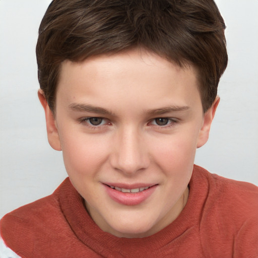 Joyful white child male with short  brown hair and grey eyes